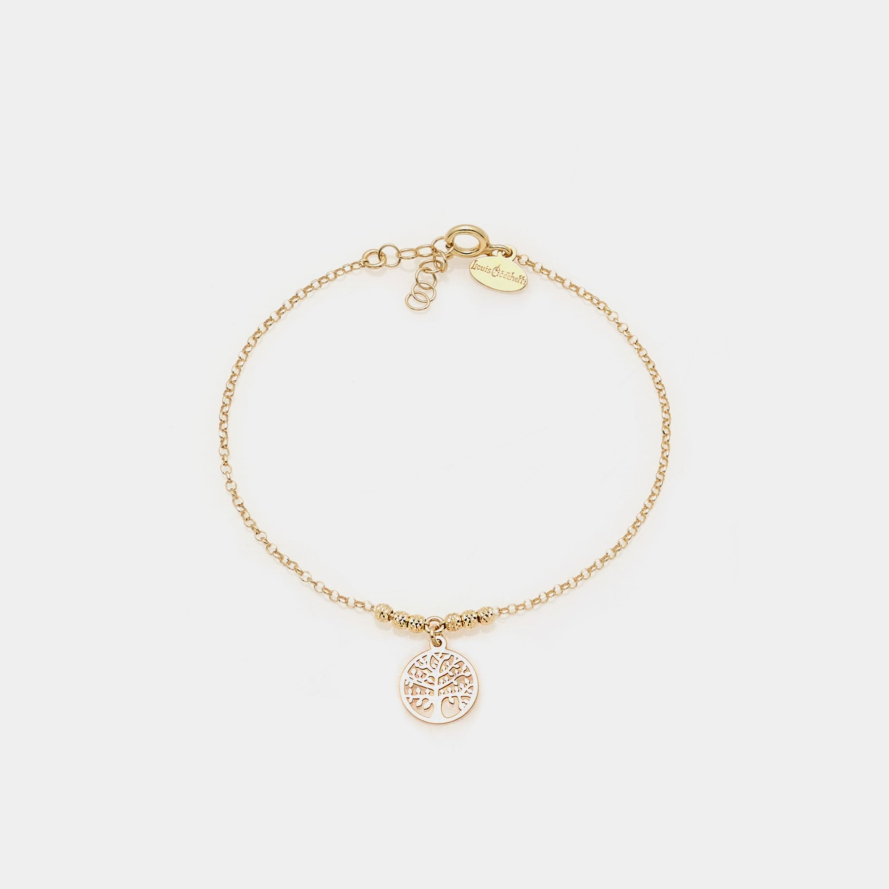Gold-plated silver bracelet with faceted spheres and round cut-out tree of life central pendant