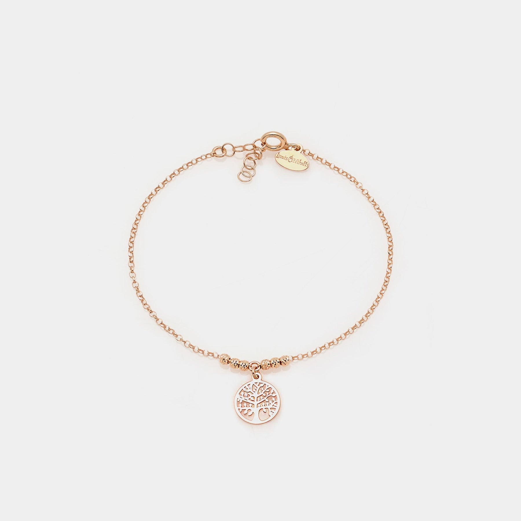 Rose gold bracelet with faceted spheres and central round cut-out tree of life pendant