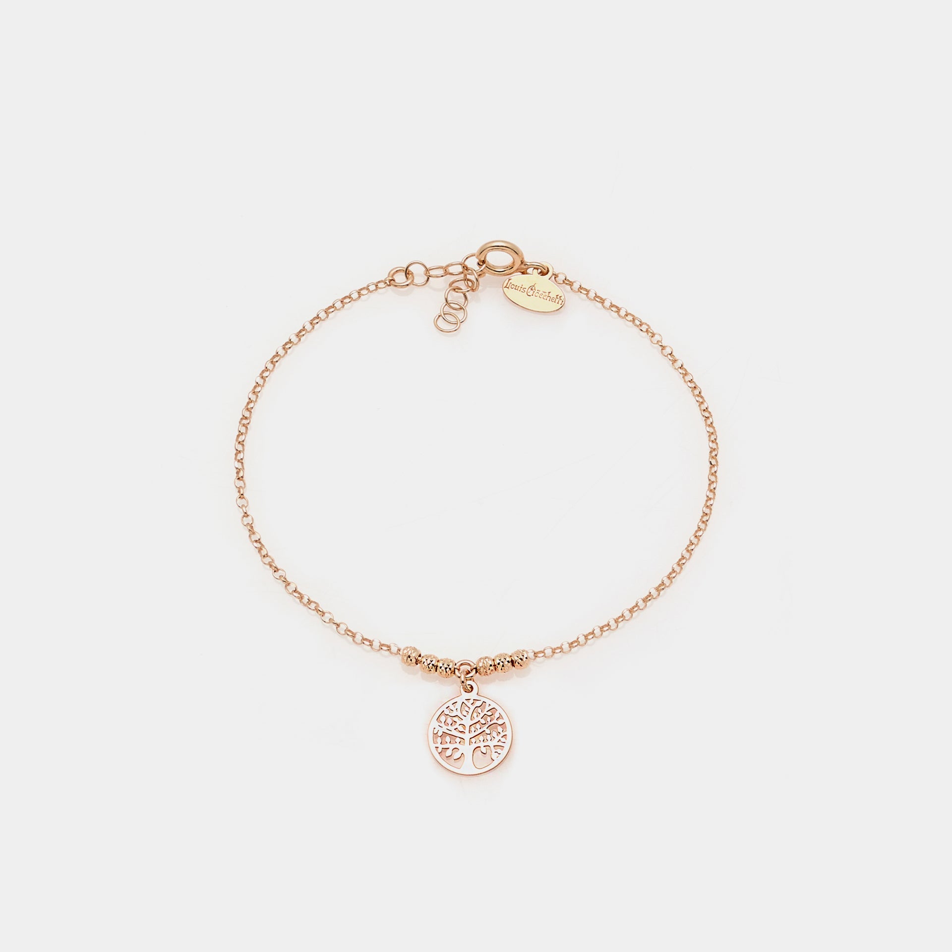 Rose gold bracelet with faceted spheres and central round cut-out tree of life pendant