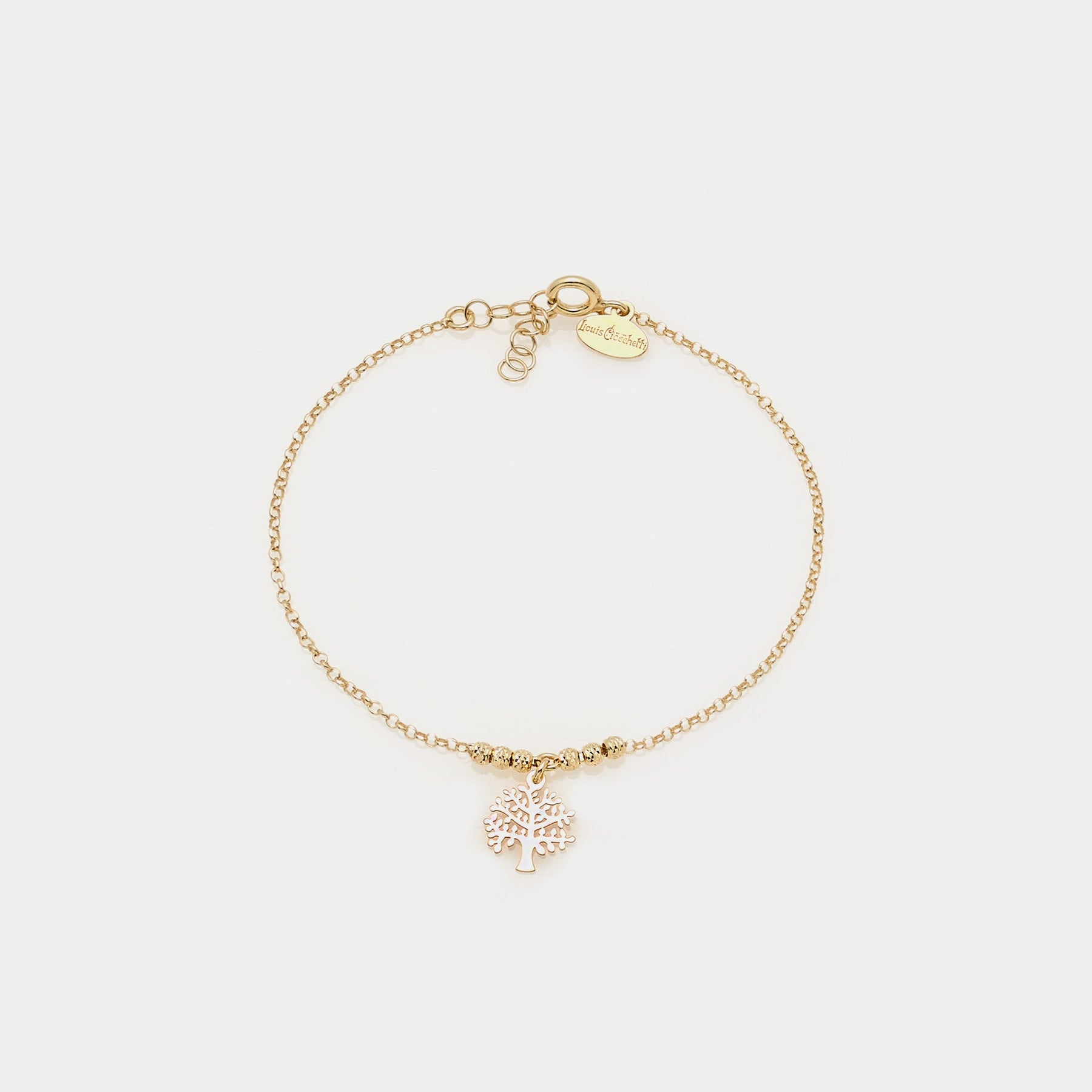 Gold-plated silver bracelet with faceted spheres and central pierced tree of life pendant