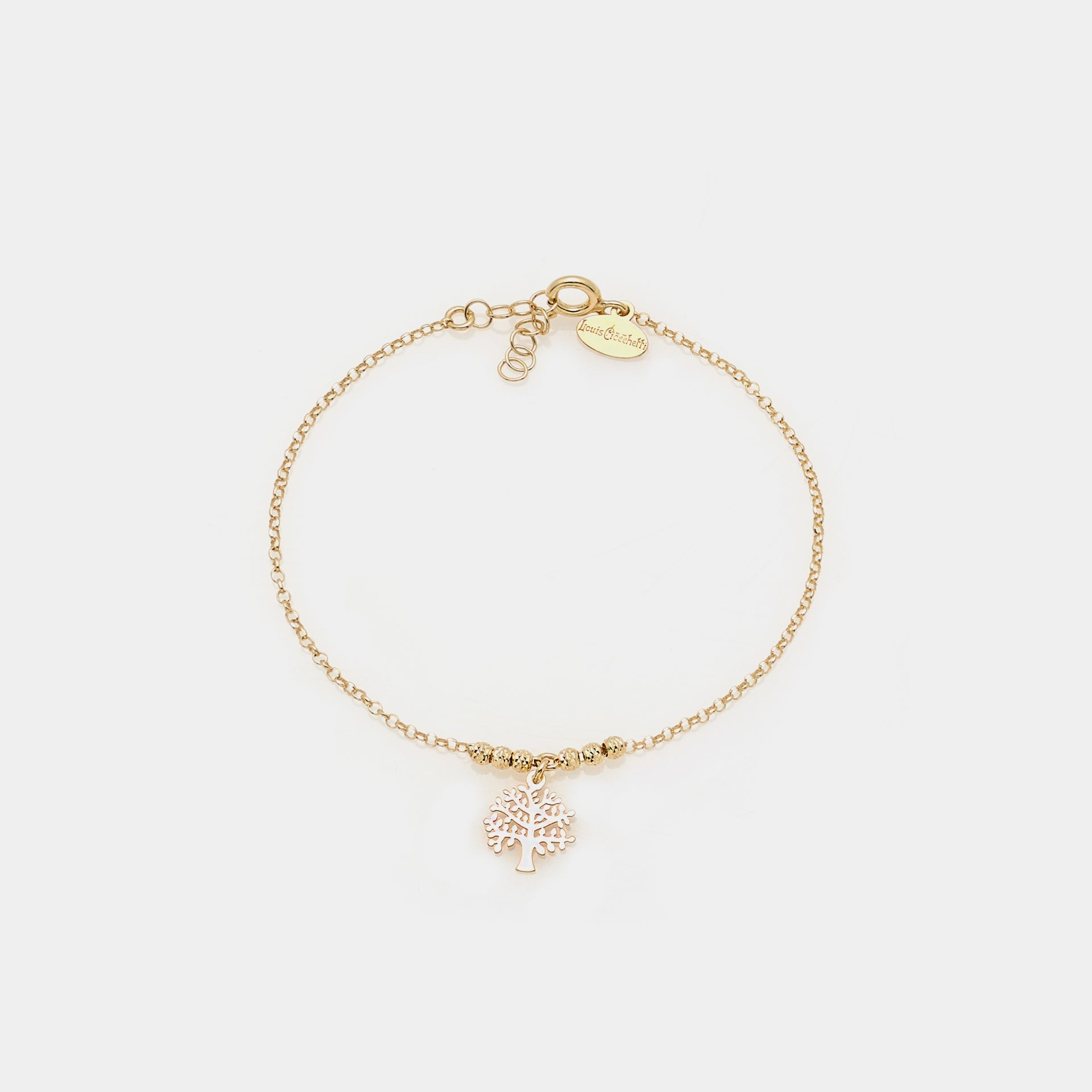 Gold-plated silver bracelet with faceted spheres and central pierced tree of life pendant