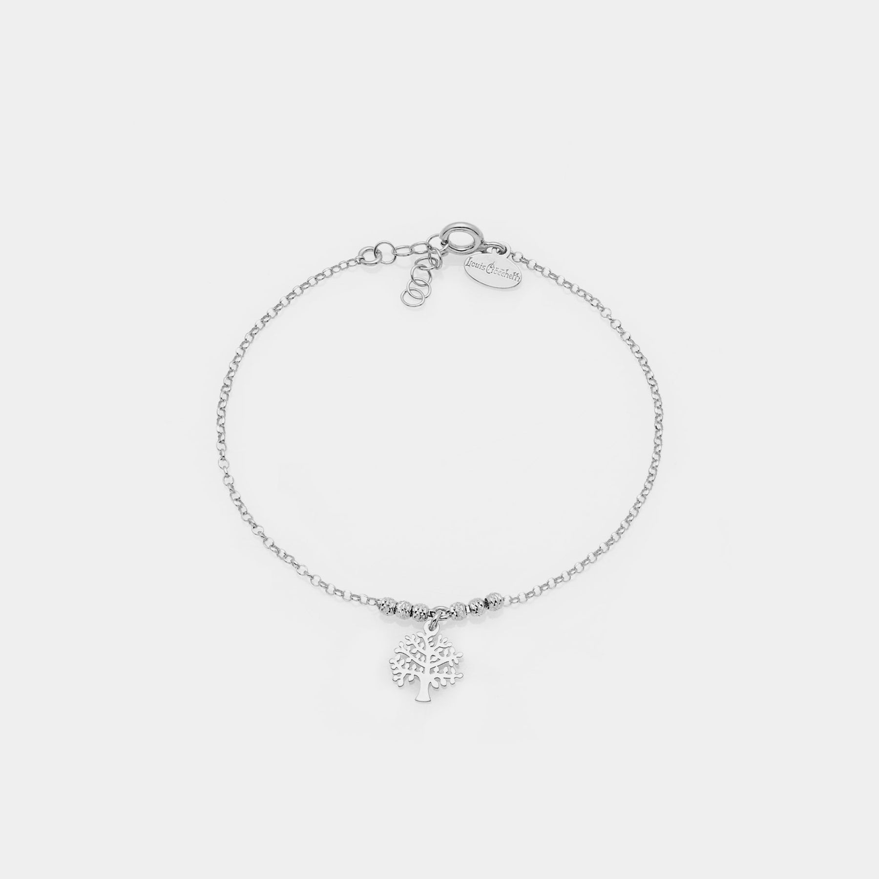 Rhodium-plated silver bracelet with faceted spheres and central pierced tree of life pendant