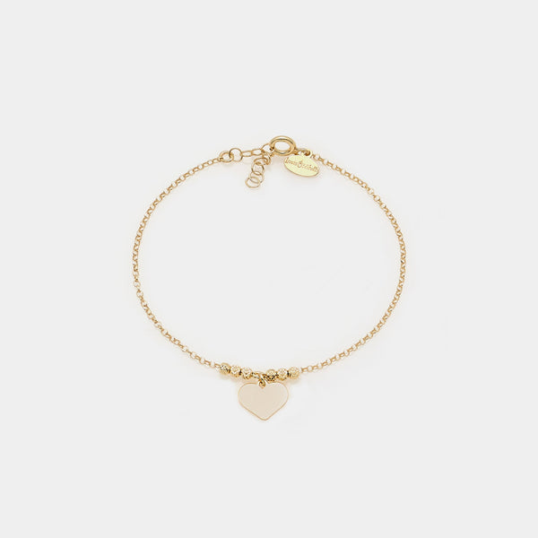 Gold-plated silver bracelet with faceted beads and central pendant heart