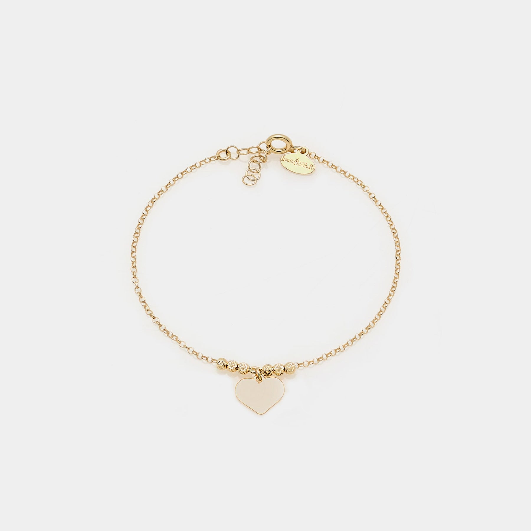 Gold-plated silver bracelet with faceted beads and central pendant heart