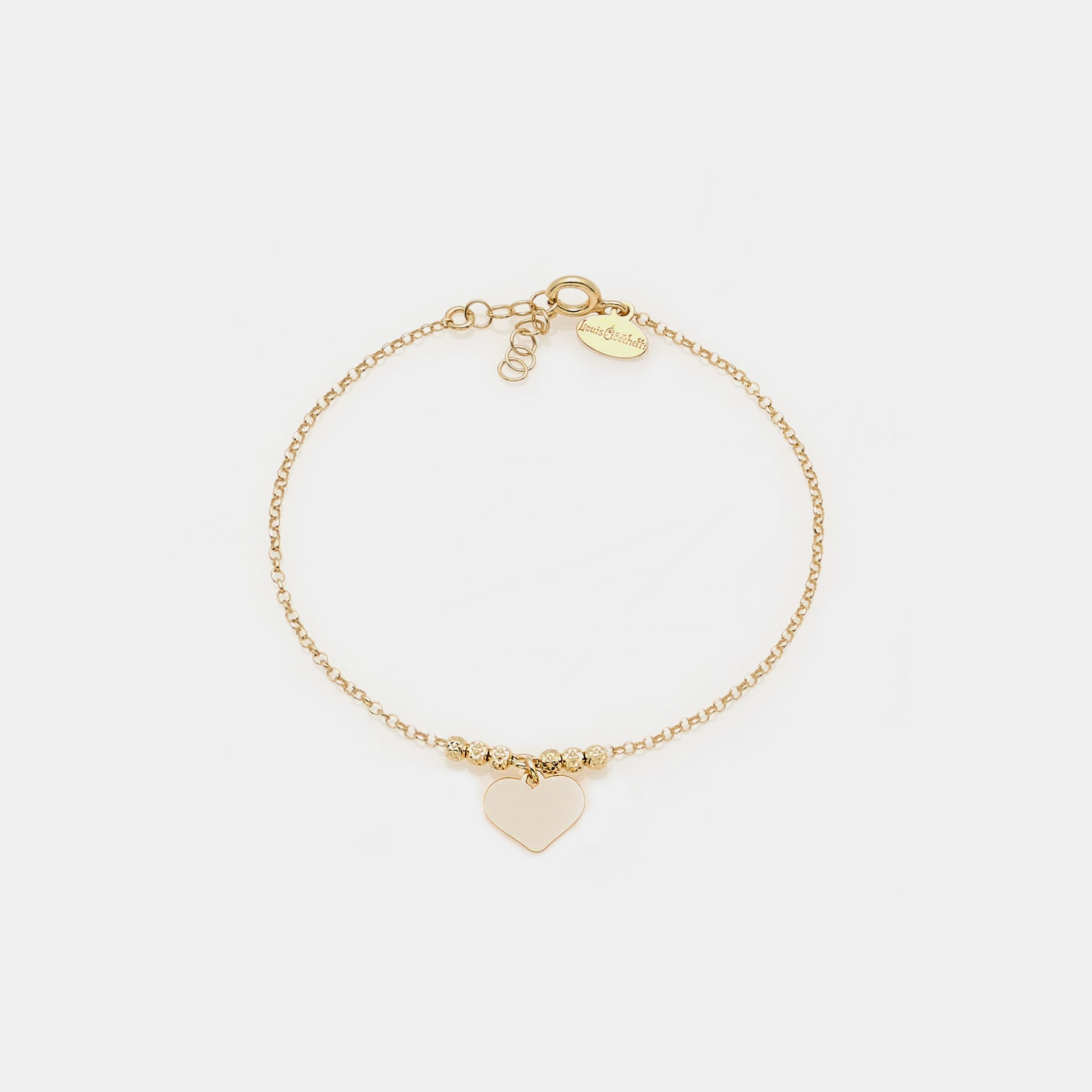 Gold-plated silver bracelet with faceted beads and central pendant heart