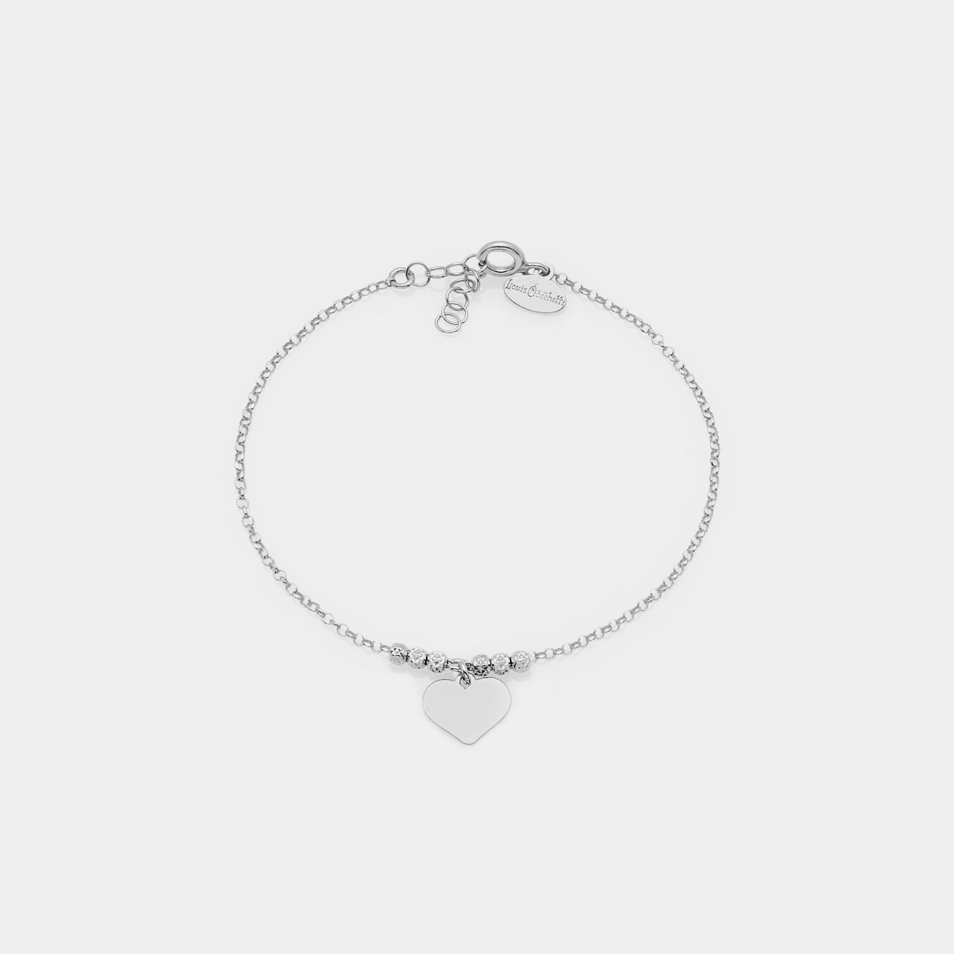 Rhodium-plated silver bracelet with faceted spheres and central dangling heart