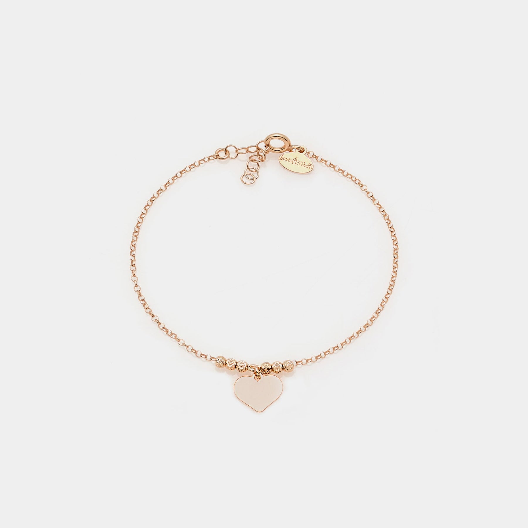 Rose gold silver bracelet with faceted spheres and dangling heart