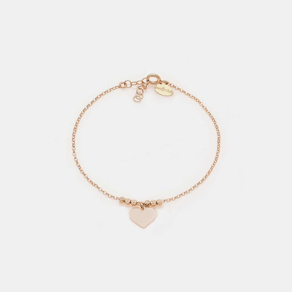 Rose gold silver bracelet with faceted spheres and dangling heart