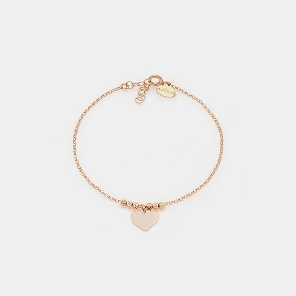 Rose gold silver bracelet with faceted spheres and dangling heart