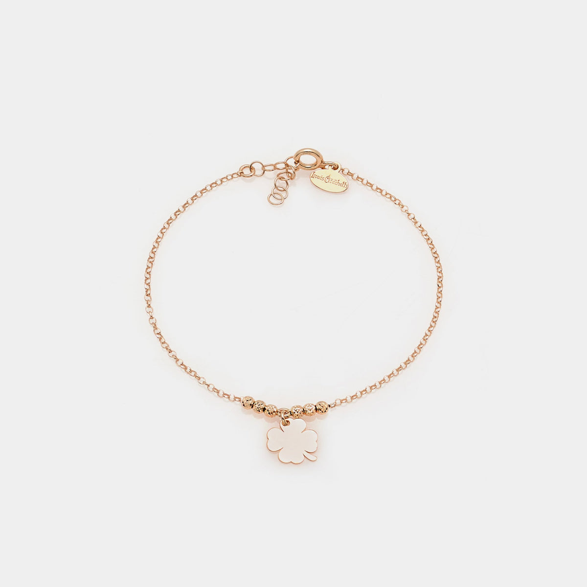 Rose gold silver bracelet with faceted spheres and central hanging four-leaf clover