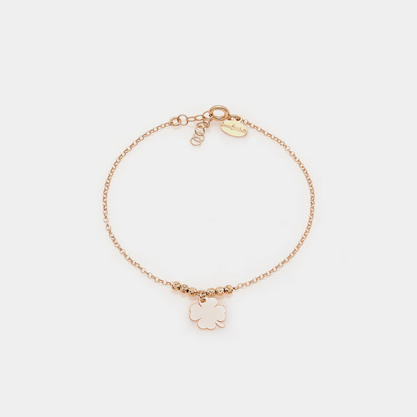 Rose gold silver bracelet with faceted spheres and central hanging four-leaf clover