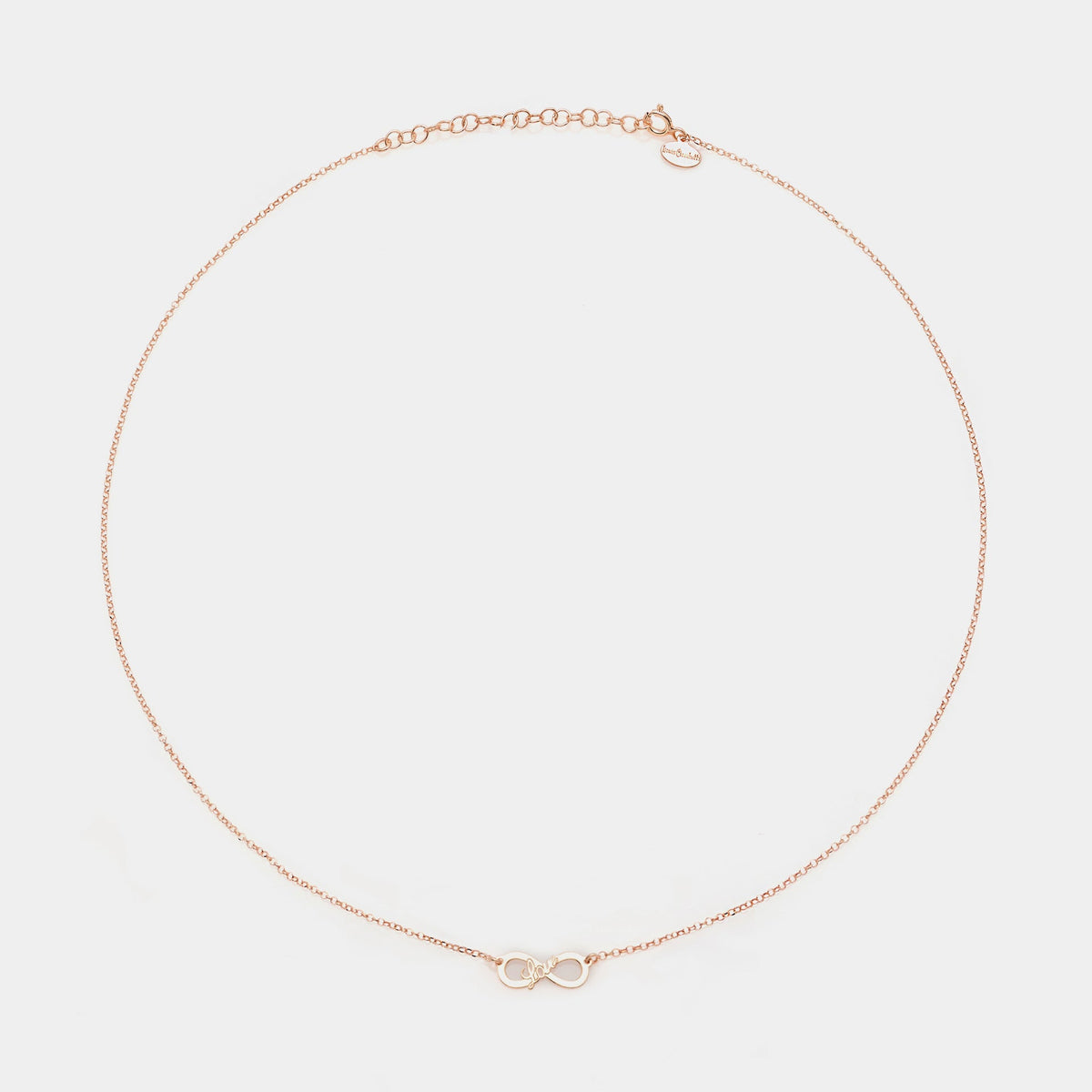 Collana argento rosato con centrale infinito traforato e scritta LOVE