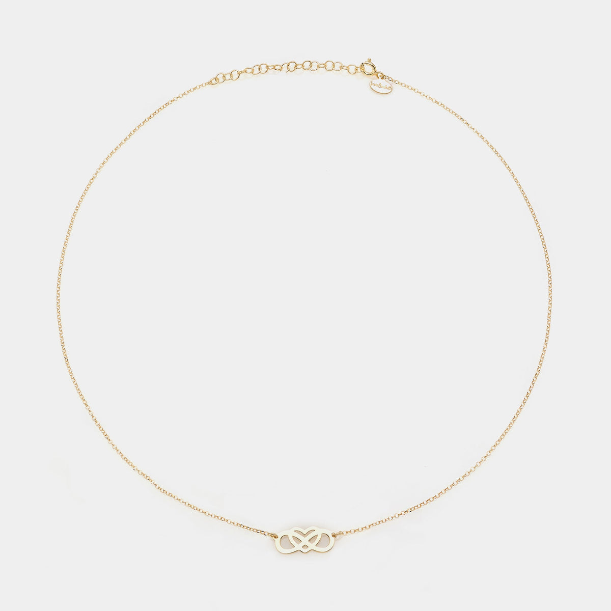 Gold-plated silver necklace with intertwined and perforated infinity center and heart