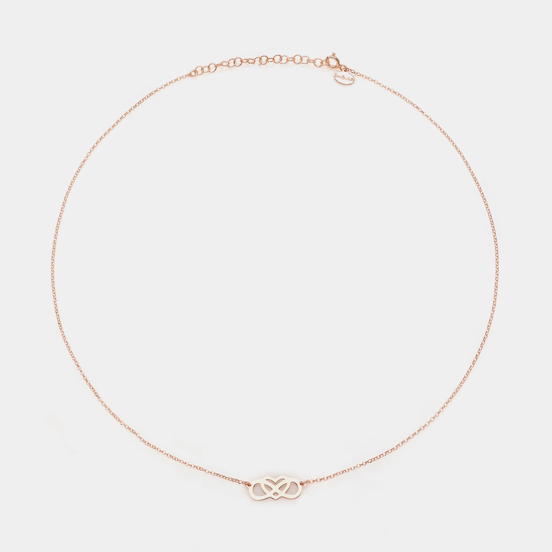 Rose gold silver necklace with intertwined and perforated infinity center and heart