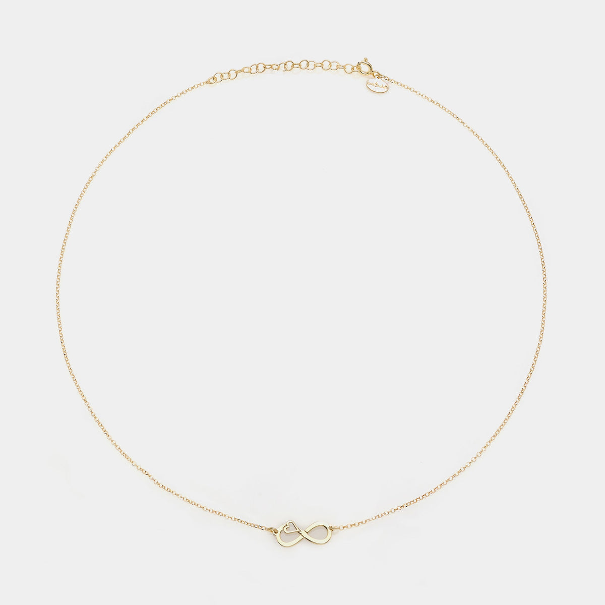 Collana argento dorato con centrale infinito traforato e cuore laterale