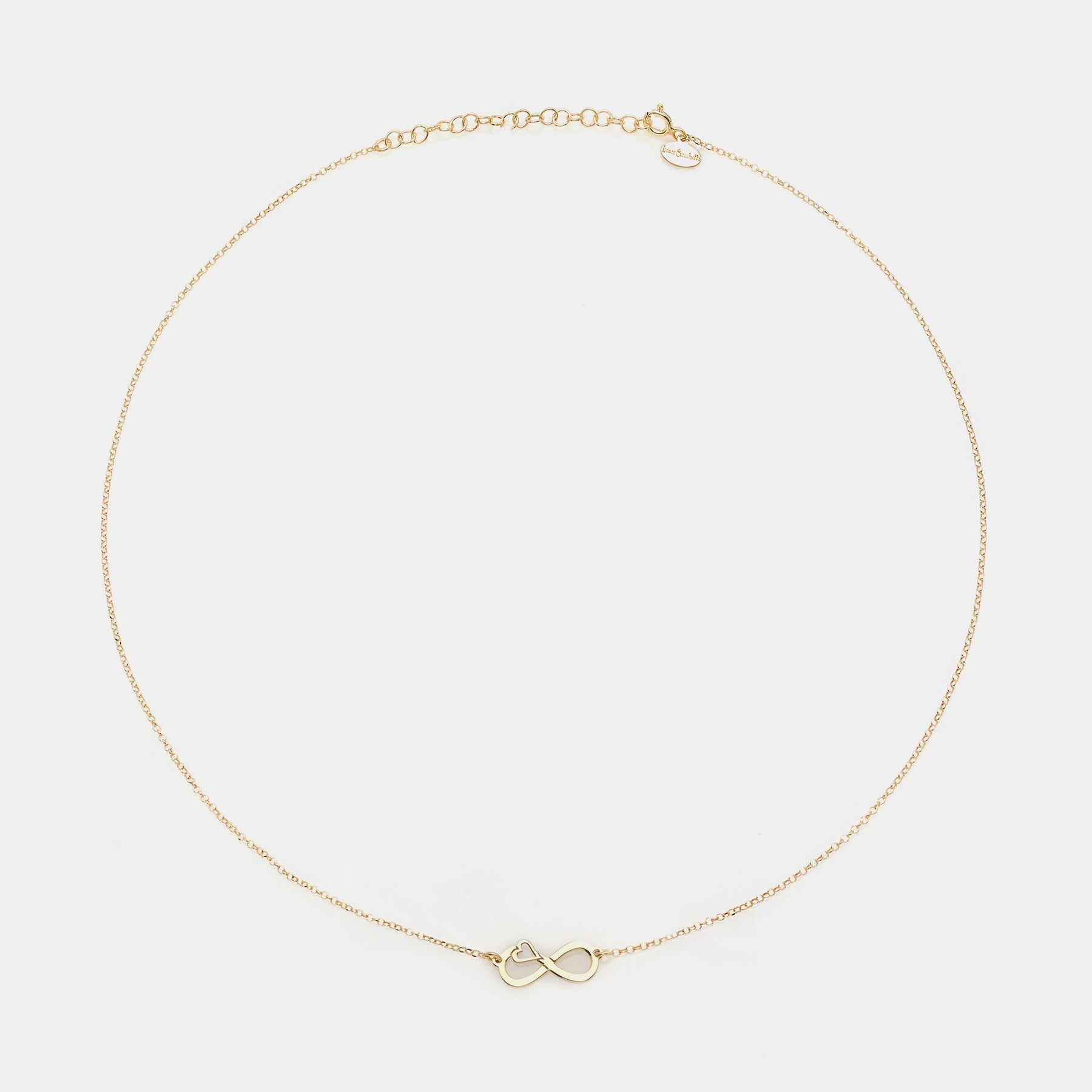 Gold-plated silver necklace with pierced infinity center and side heart