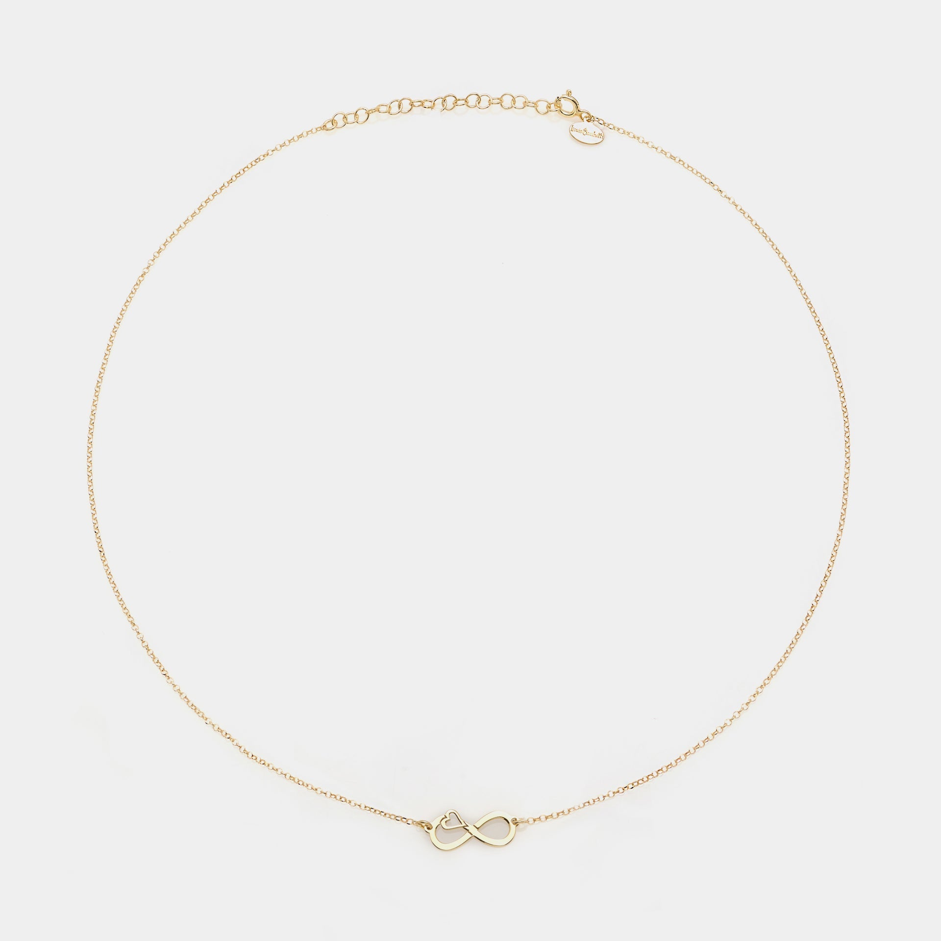 Gold-plated silver necklace with pierced infinity center and side heart