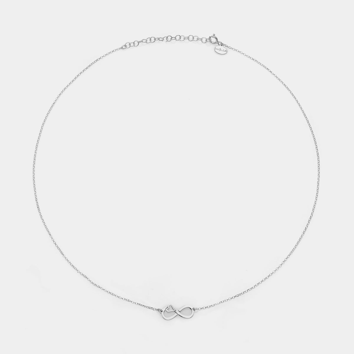 Rhodium-plated silver necklace with pierced infinity center and side heart