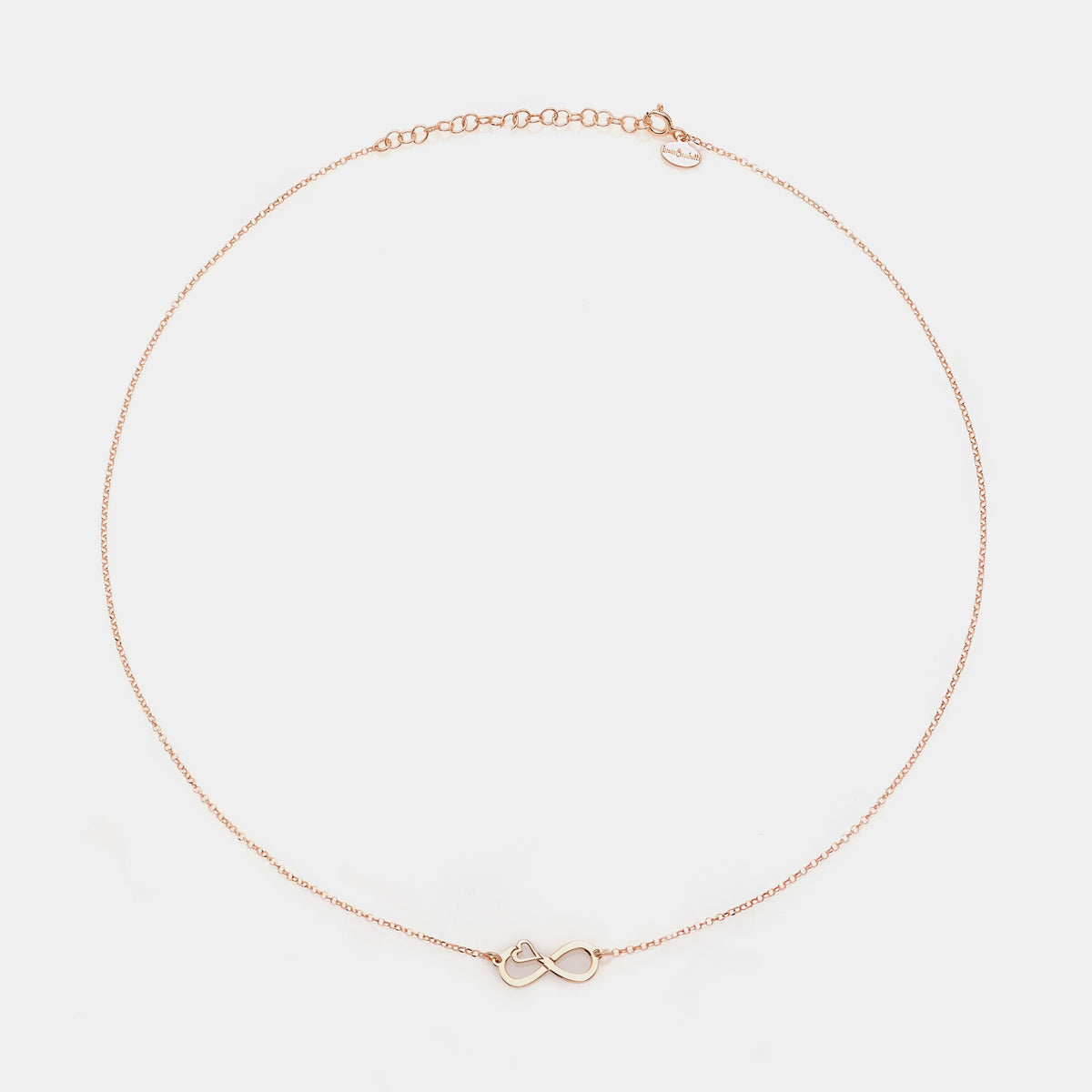 Rose gold silver necklace with pierced infinity center and side heart