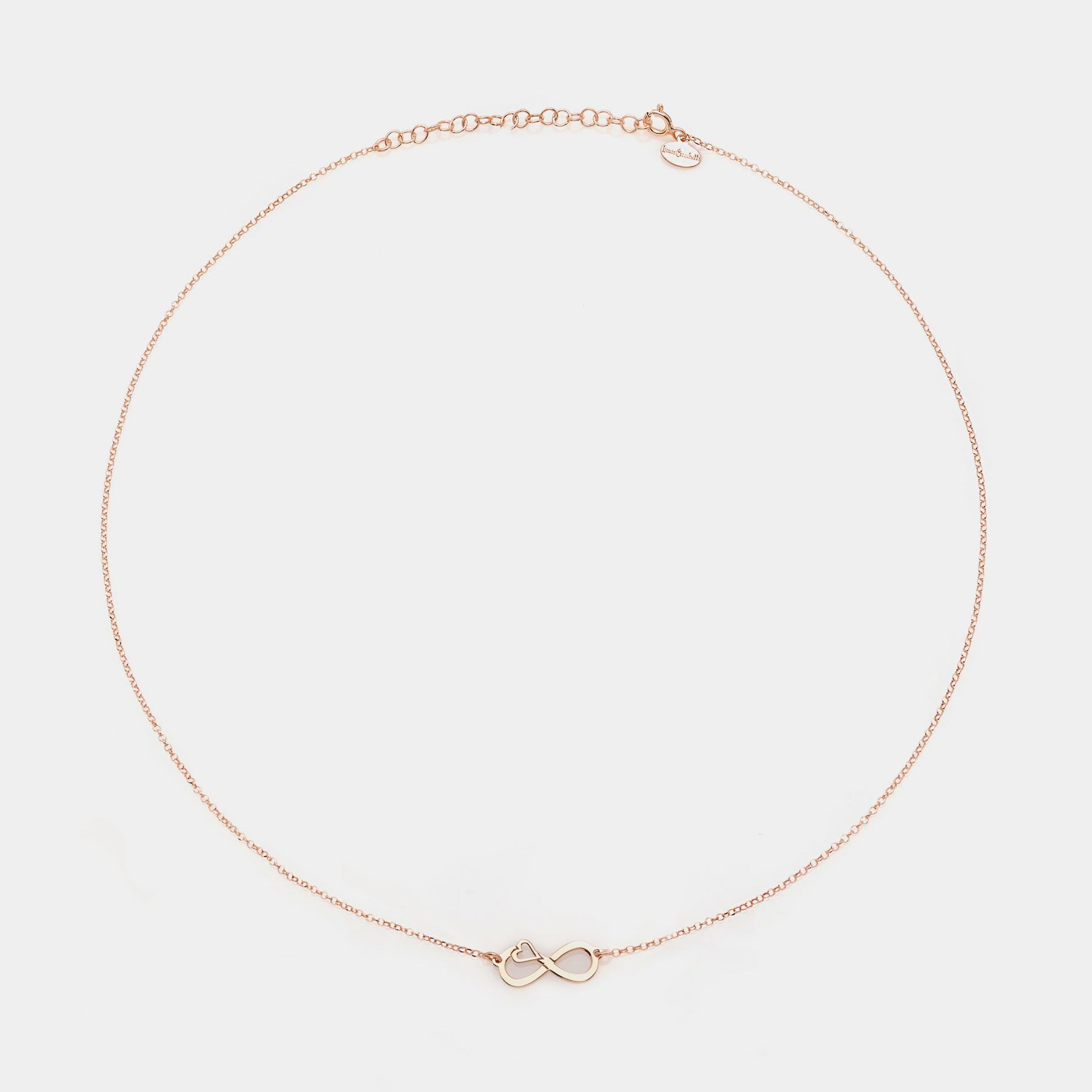 Rose gold silver necklace with pierced infinity center and side heart