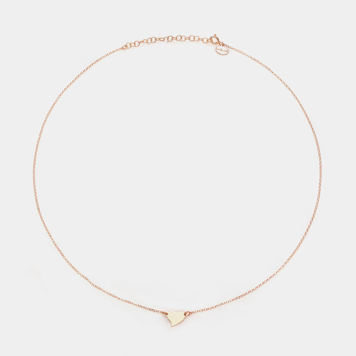 Rose gold silver necklace with twisted heart centerpiece