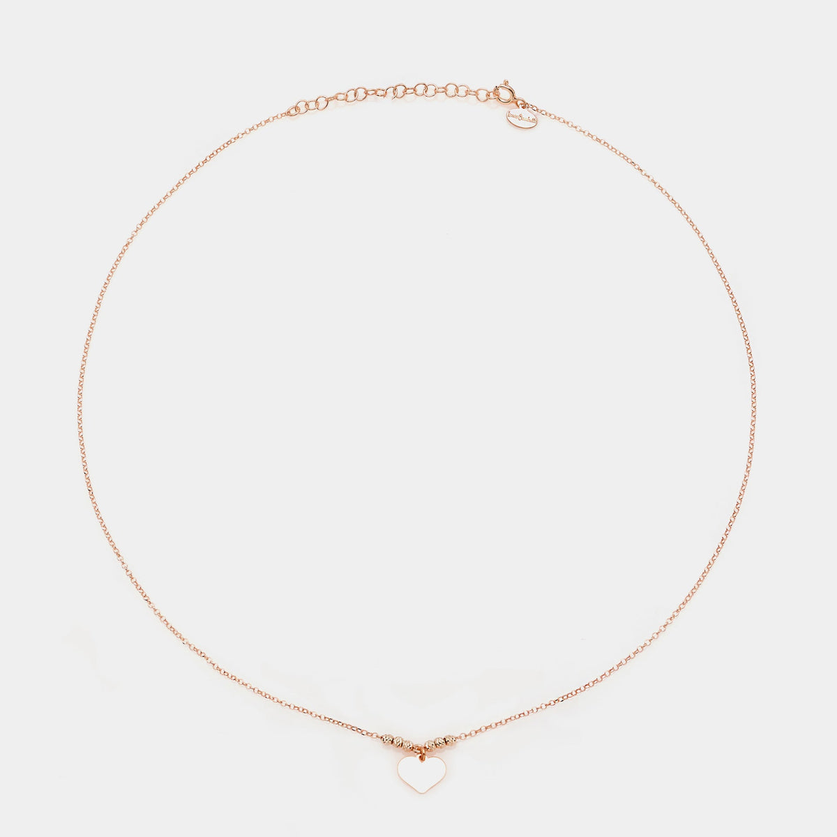 Rose gold silver necklace with classic heart pendant and faceted spheres on the sides