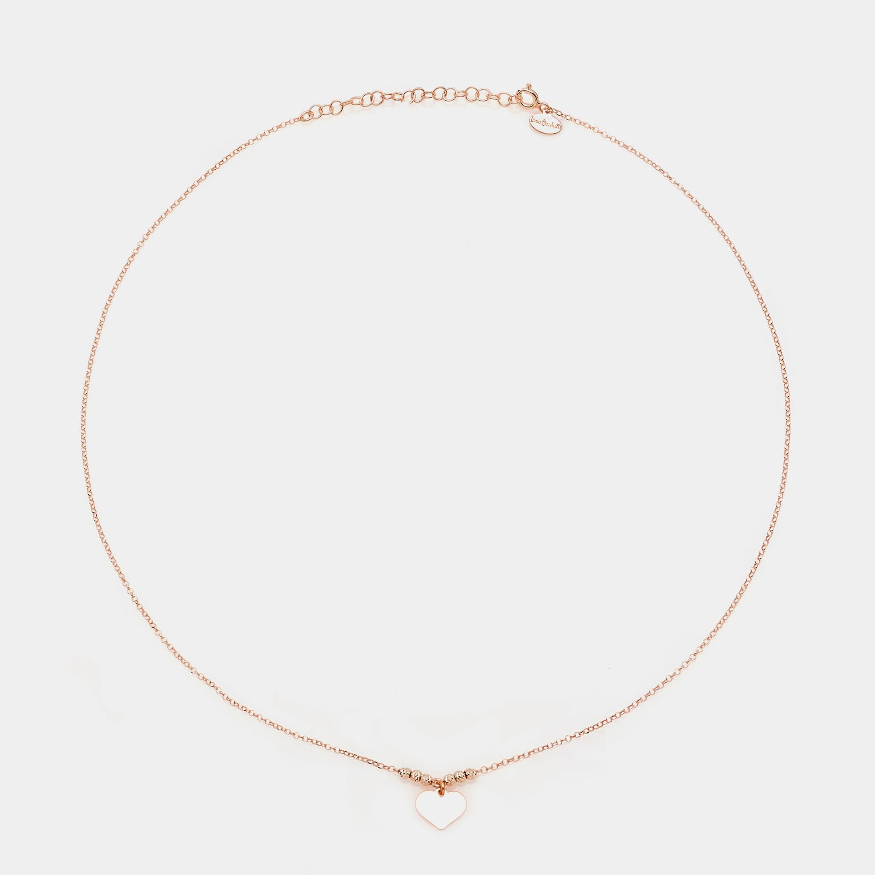 Rose gold silver necklace with classic heart pendant and faceted spheres on the sides