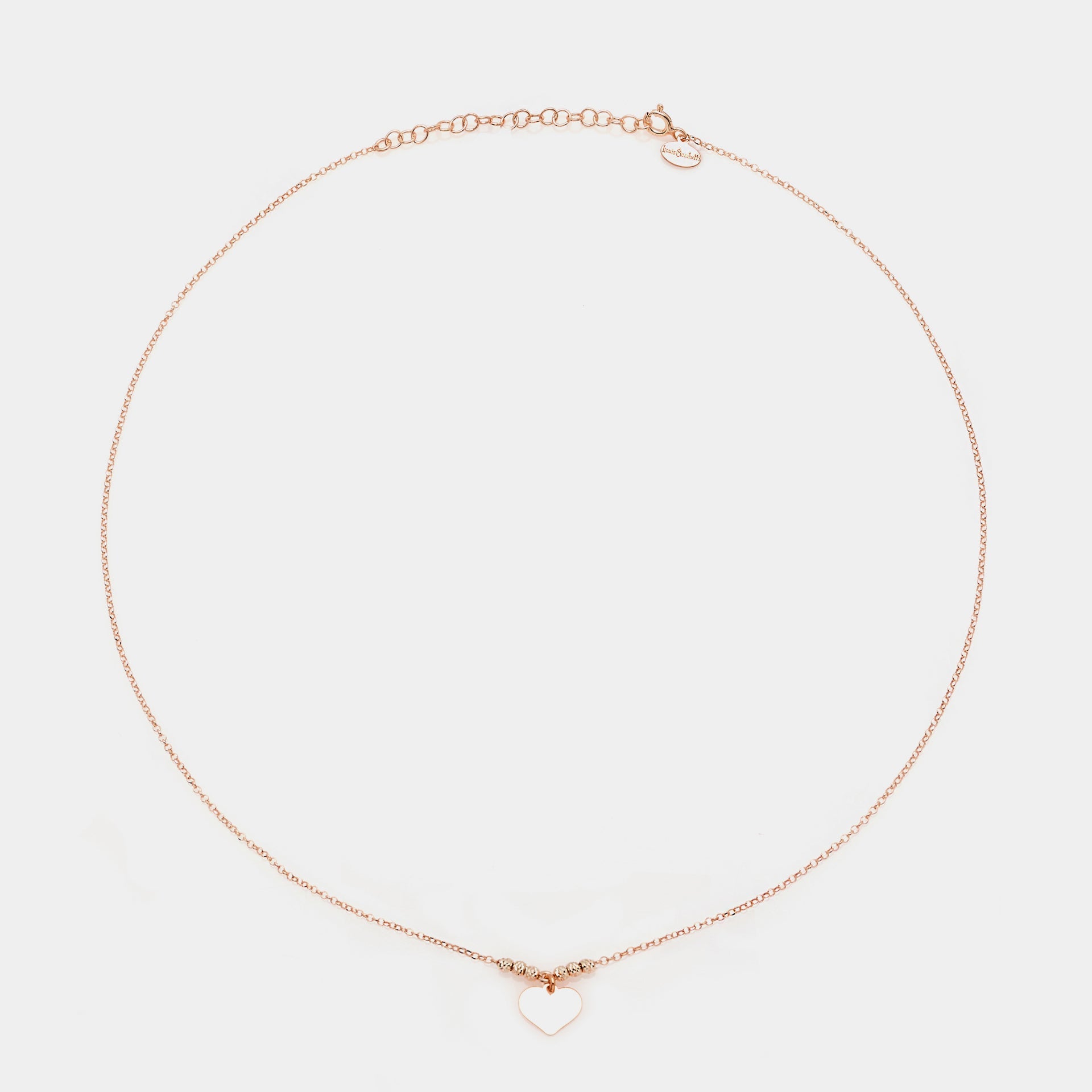 Rose gold silver necklace with classic heart pendant and faceted spheres on the sides