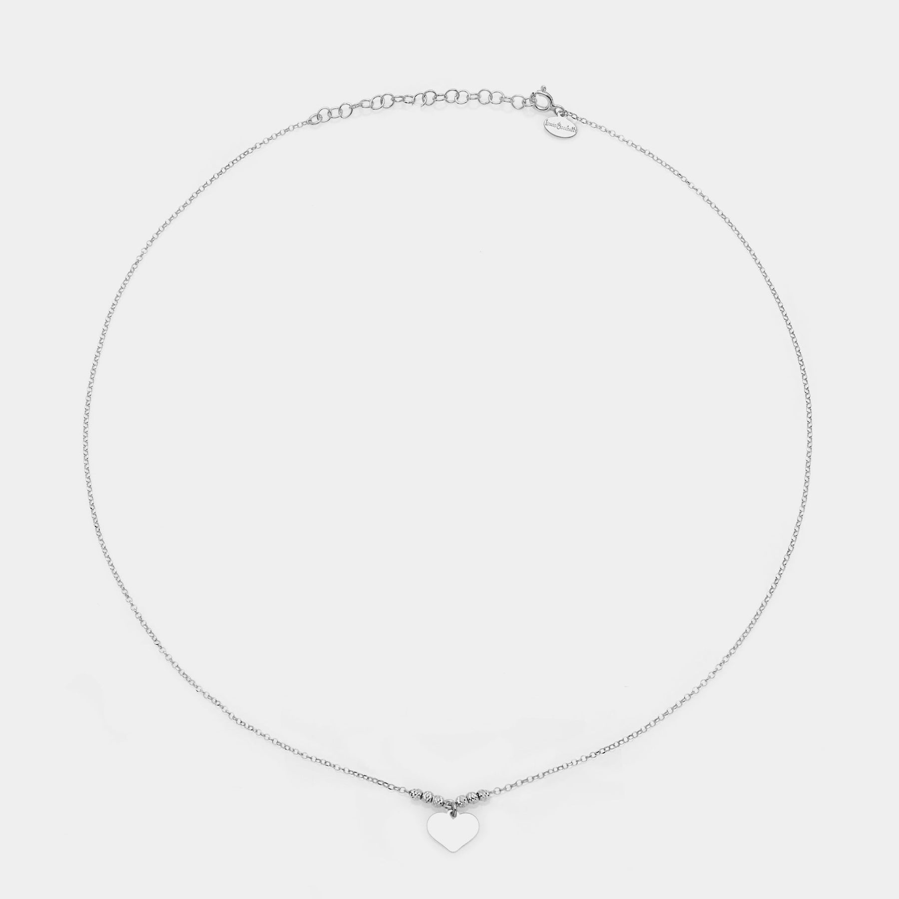 Rhodium-plated silver necklace with classic heart pendant and 3 faceted spheres on the sides