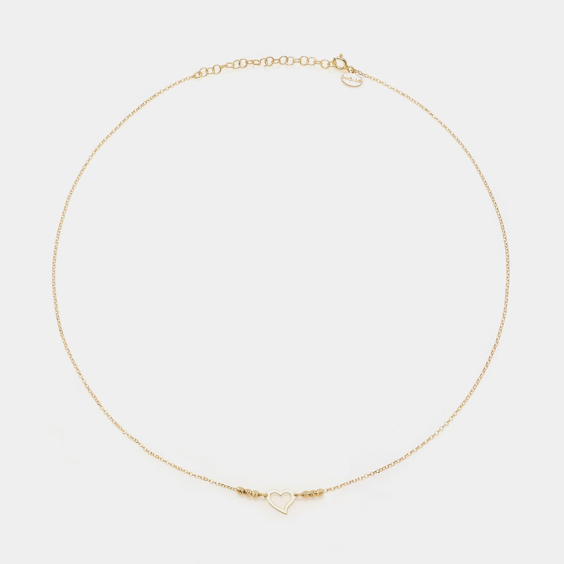 Gold-plated silver necklace with twisted heart centerpiece and faceted spheres on the sides
