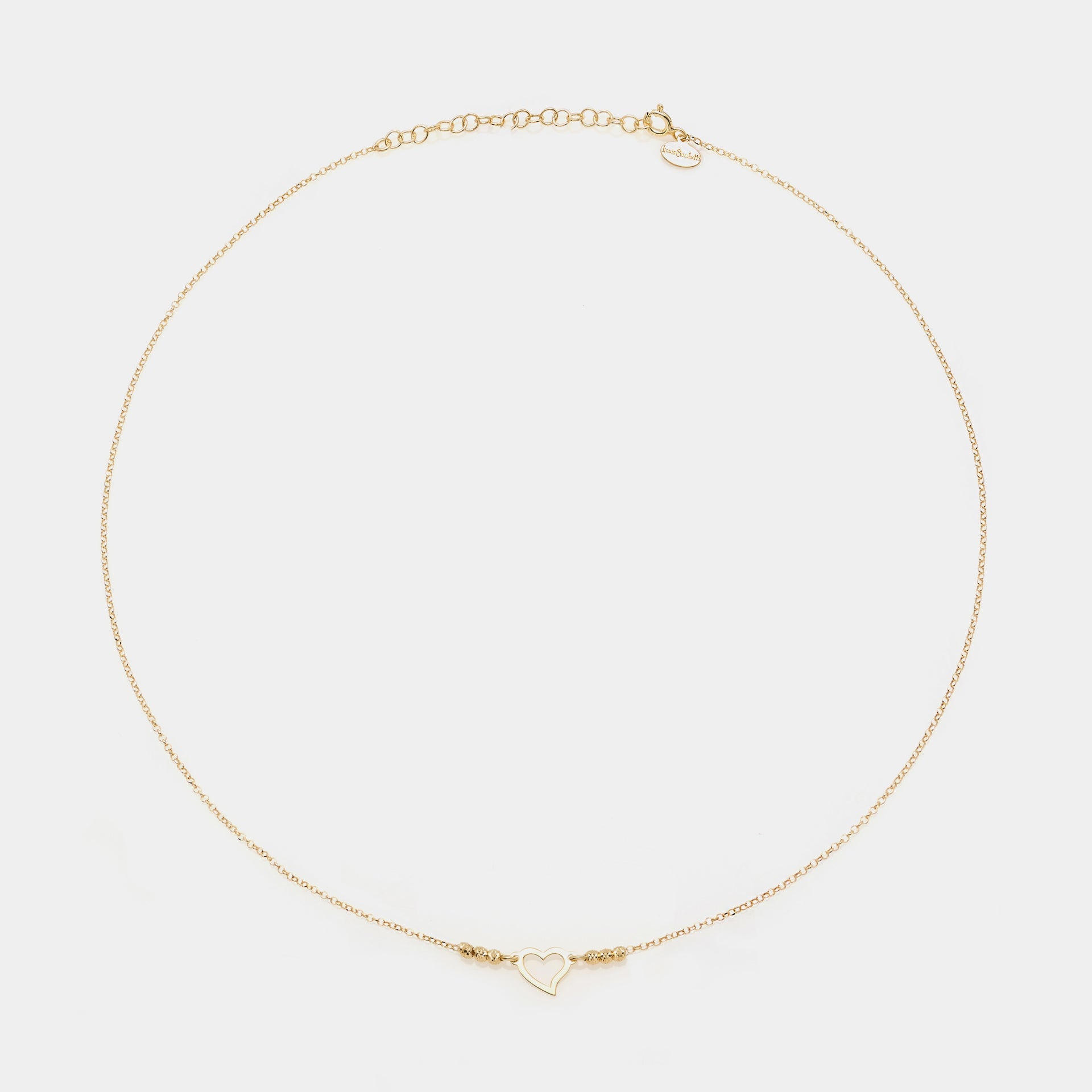 Gold-plated silver necklace with twisted heart centerpiece and faceted spheres on the sides