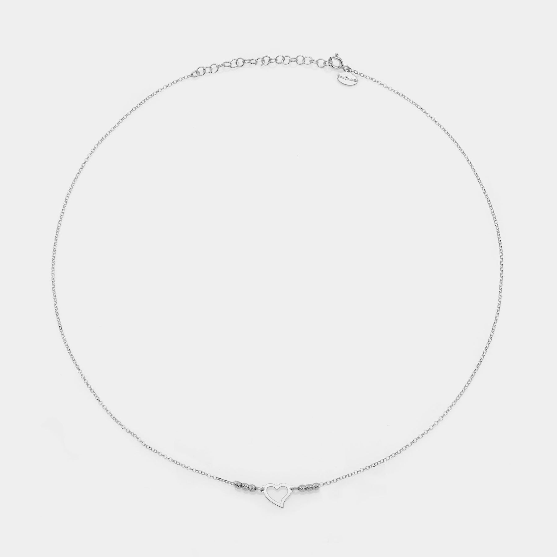 Rhodium-plated silver necklace with twisted heart centerpiece and 3 faceted spheres on the sides