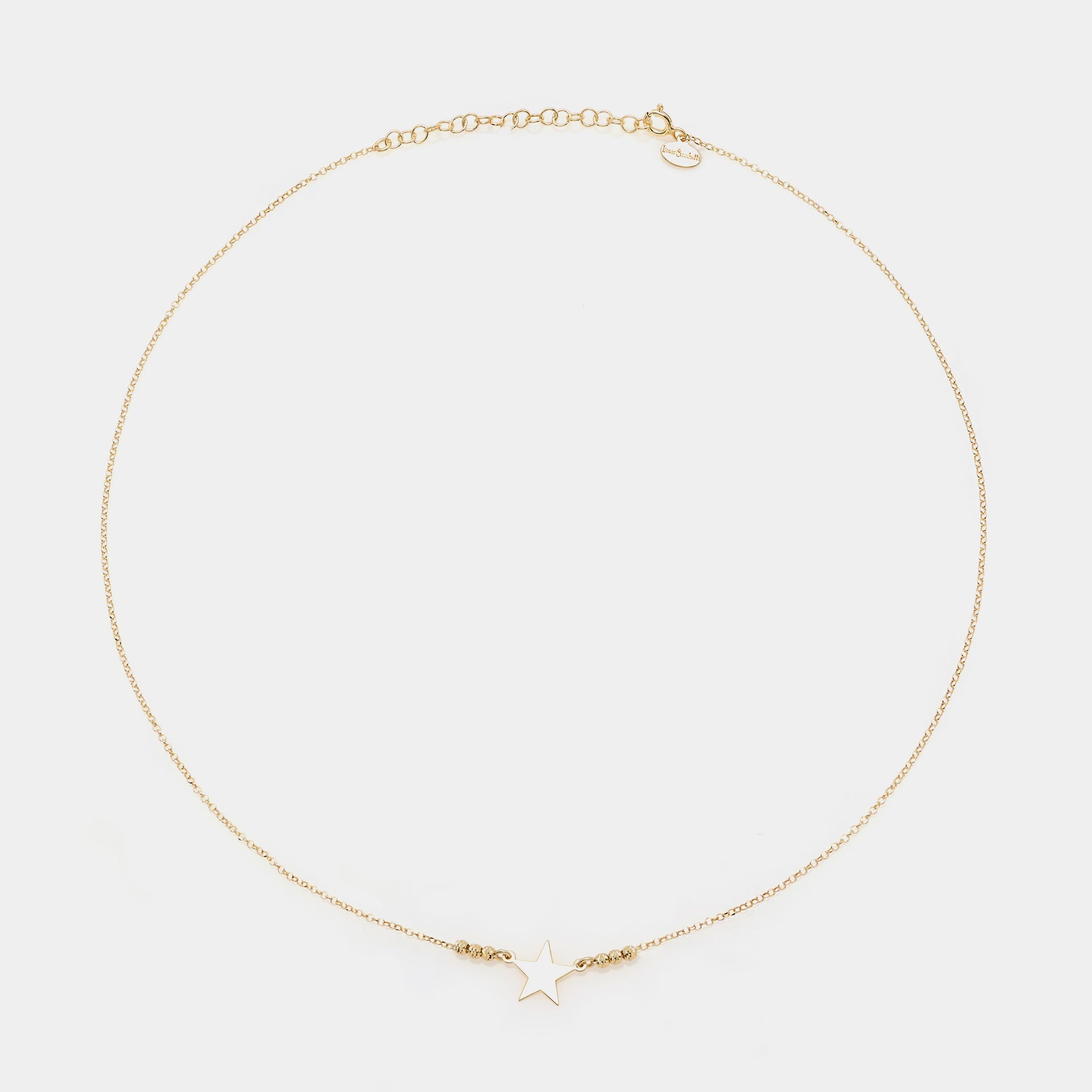 Gold-plated silver necklace with star centerpiece and faceted spheres on the sides