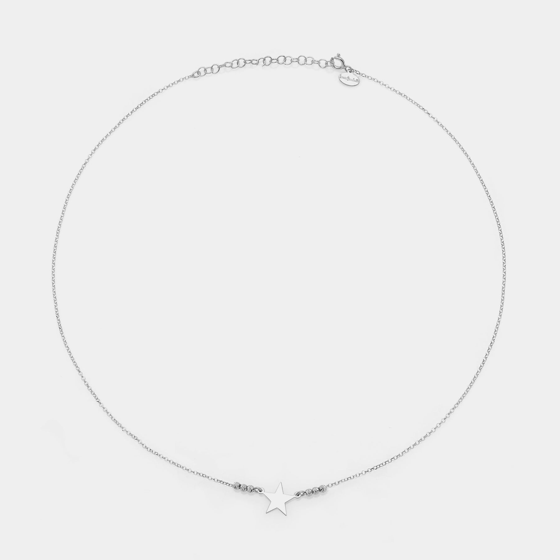 Rhodium-plated silver necklace with star centerpiece and 3 faceted spheres on the sides