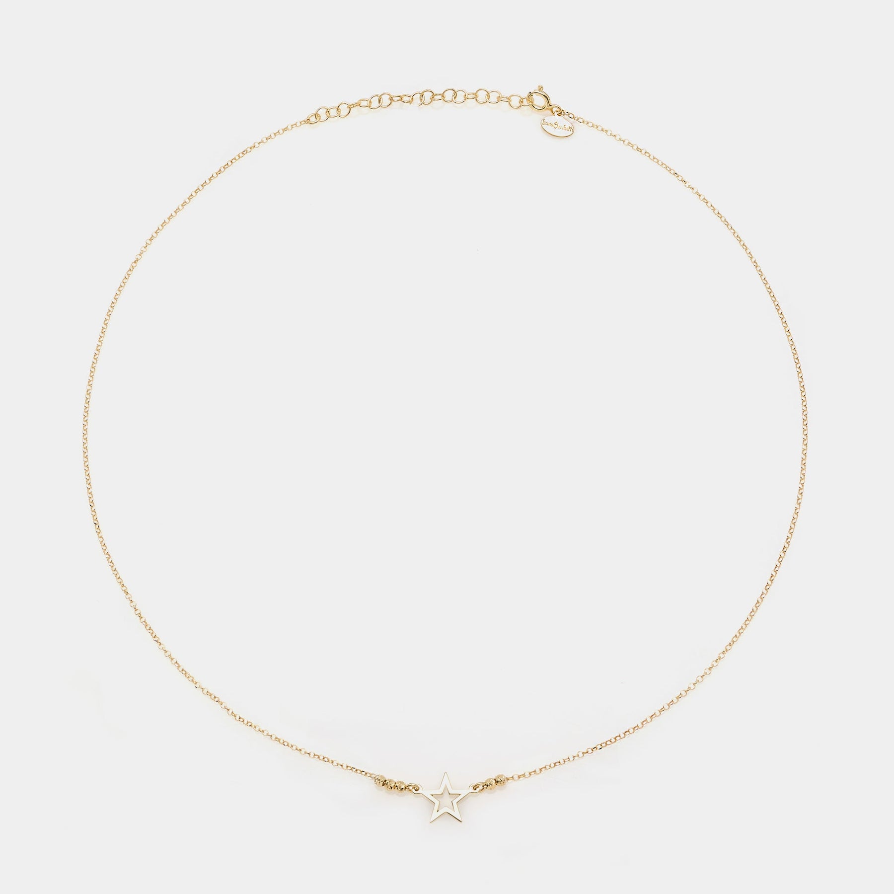 Gold-plated silver necklace with pierced star centerpiece and faceted spheres on the sides