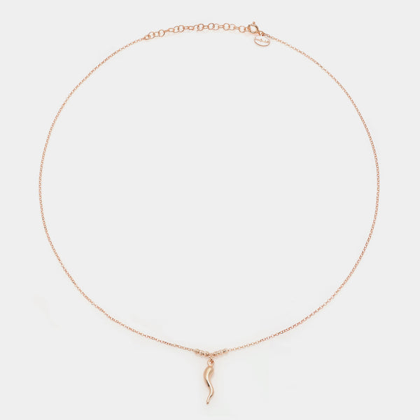 Rose gold silver necklace with a central smooth horn pendant and 3 faceted spheres on the sides