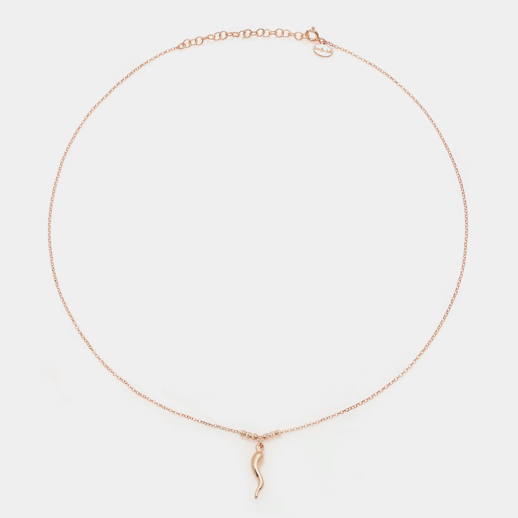 Rose gold silver necklace with a central smooth horn pendant and 3 faceted spheres on the sides