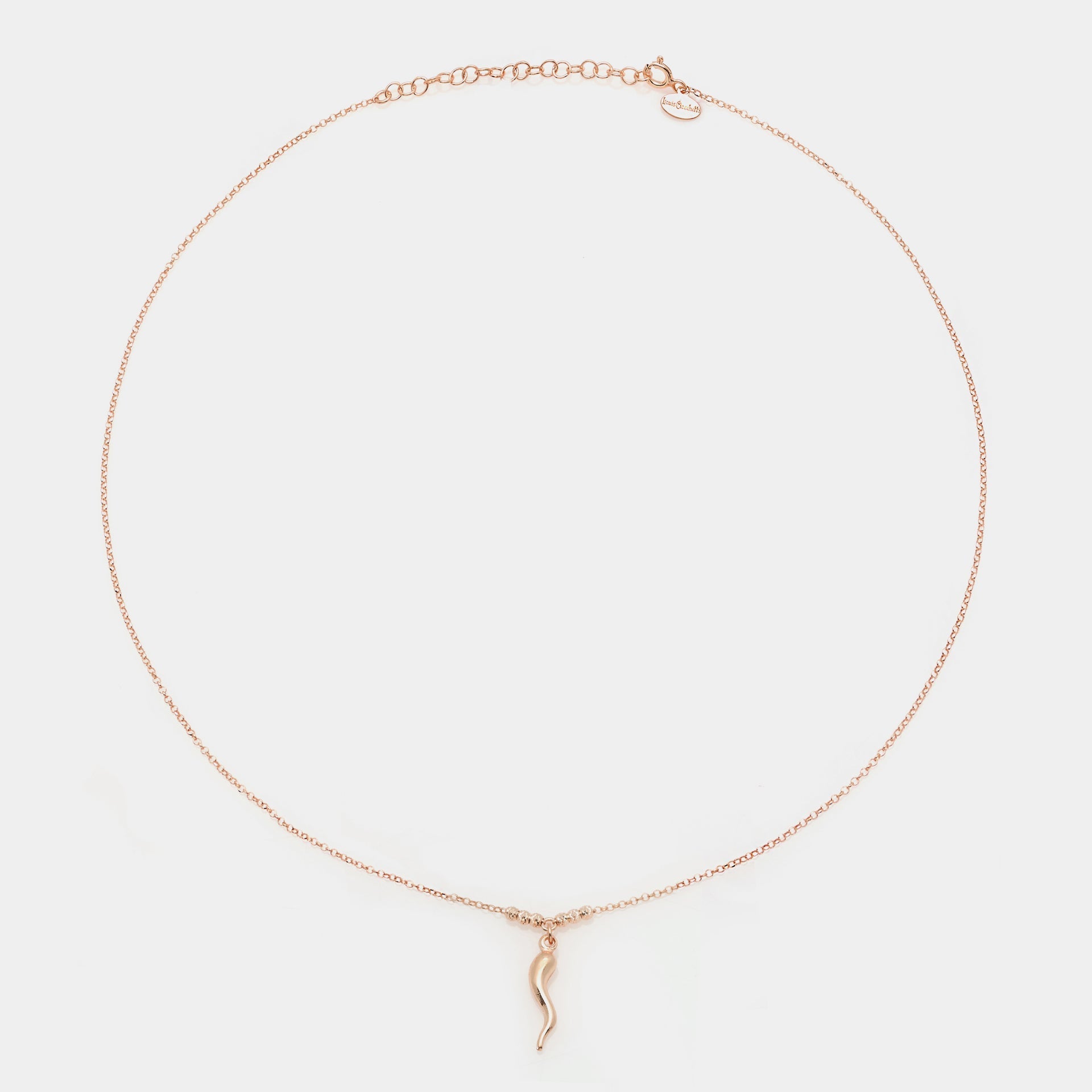 Rose gold silver necklace with a central smooth horn pendant and 3 faceted spheres on the sides