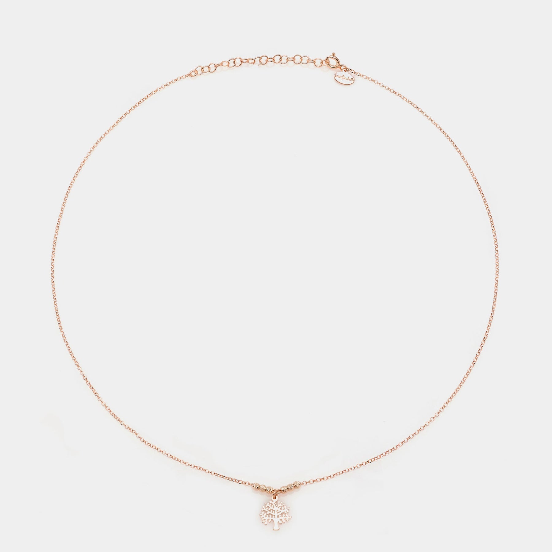 Rose gold silver necklace with pierced tree of life pendant and faceted spheres on the sides