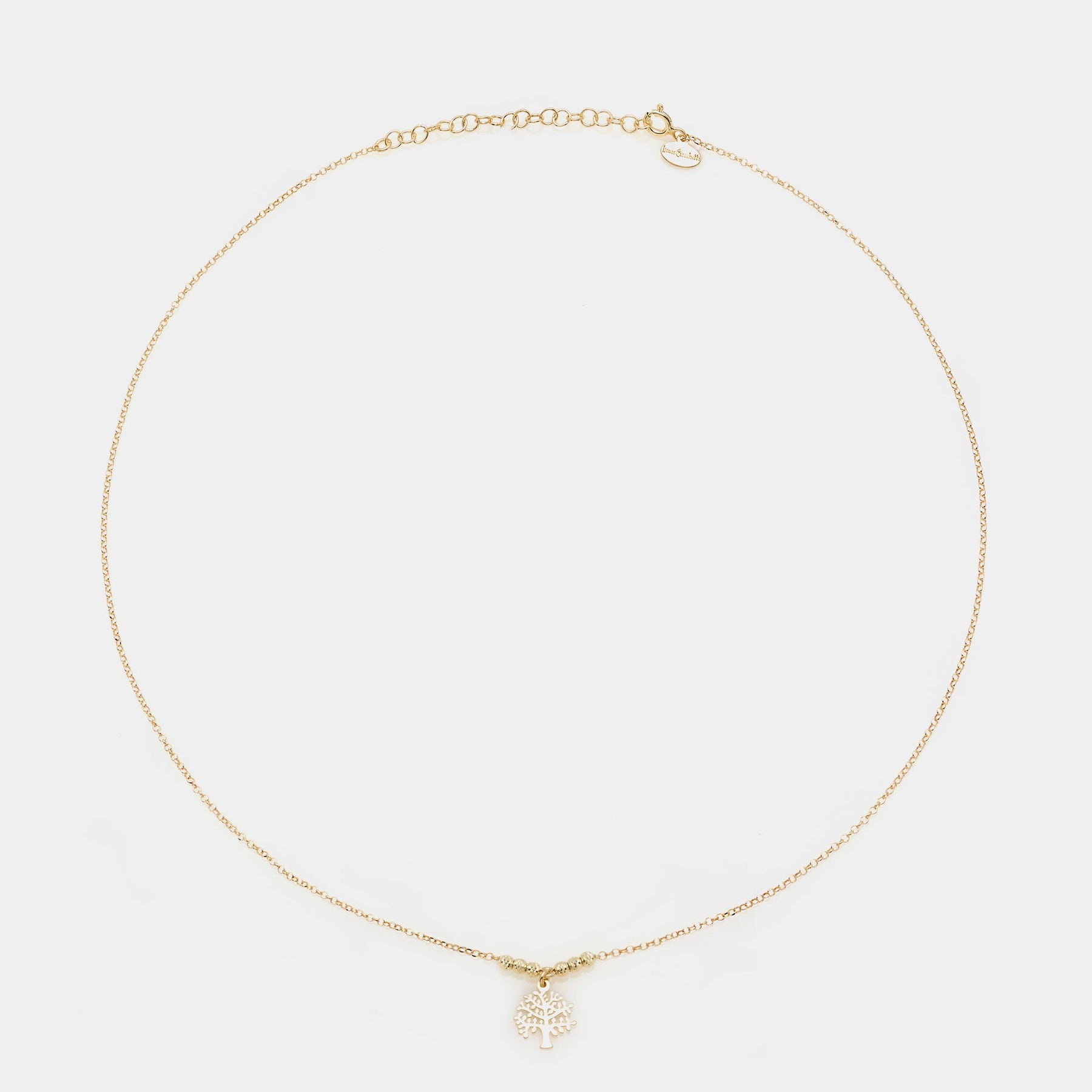 Rose gold necklace with a central pierced tree of life pendant and faceted spheres on the sides