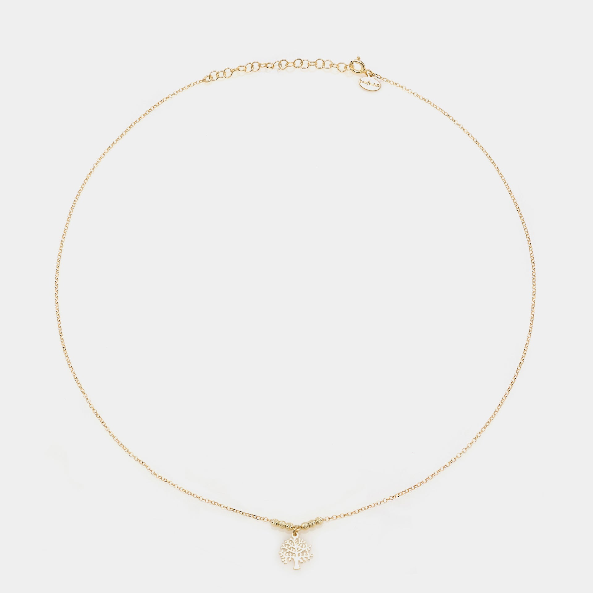 Rose gold necklace with a central pierced tree of life pendant and faceted spheres on the sides