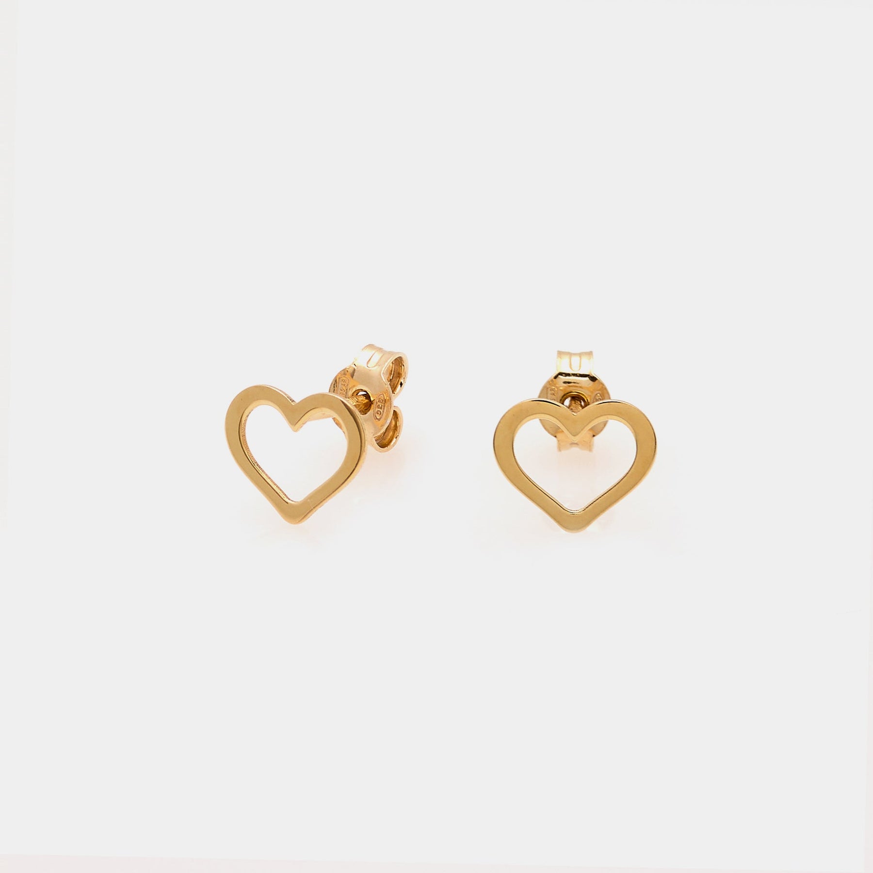 Gold-plated silver stud earrings with pierced heart