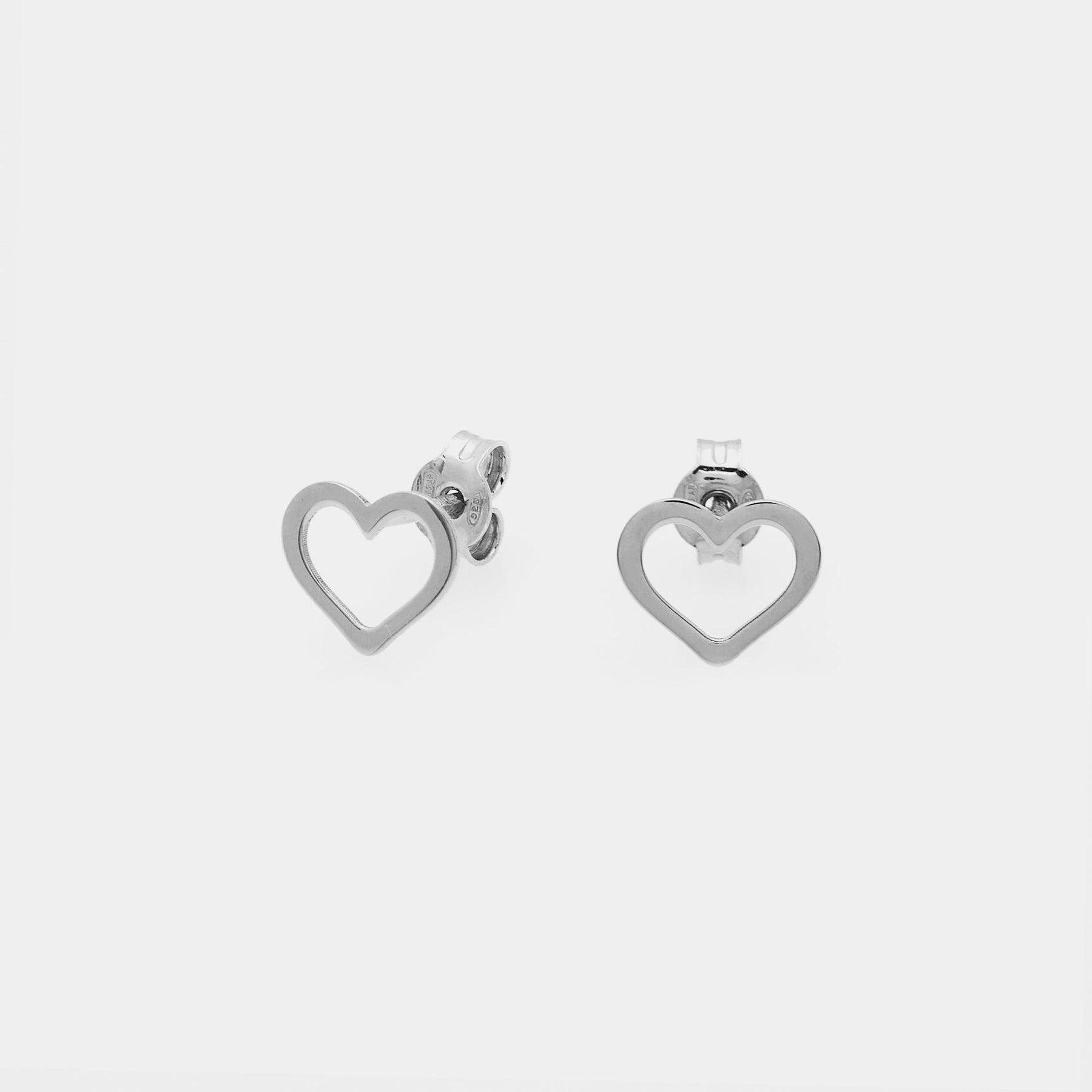 Heart-shaped pierced silver stud earrings