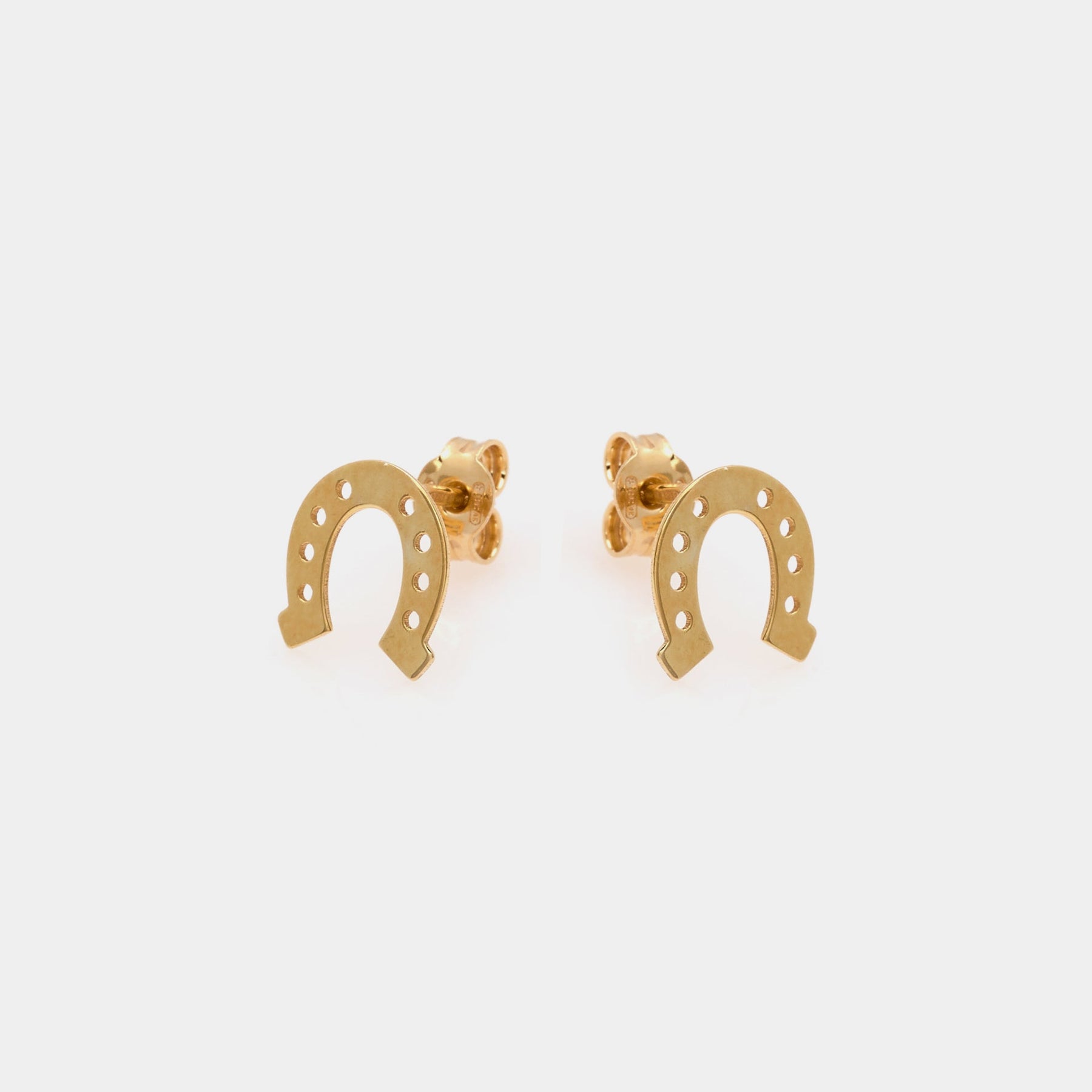 Gold-plated silver stud earrings in the shape of a horseshoe