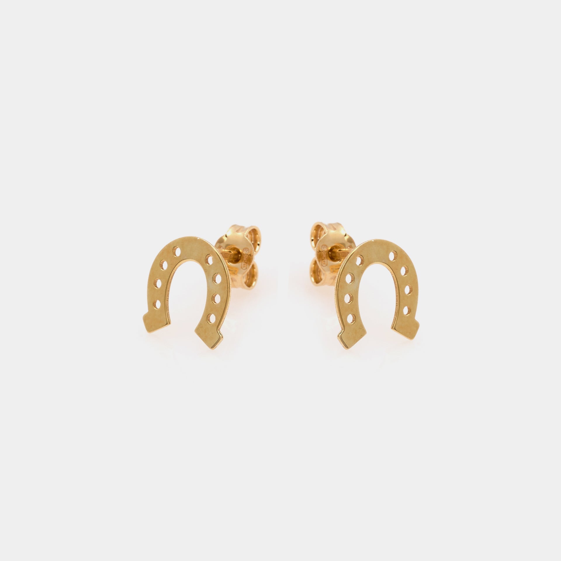 Gold-plated silver stud earrings in the shape of a horseshoe