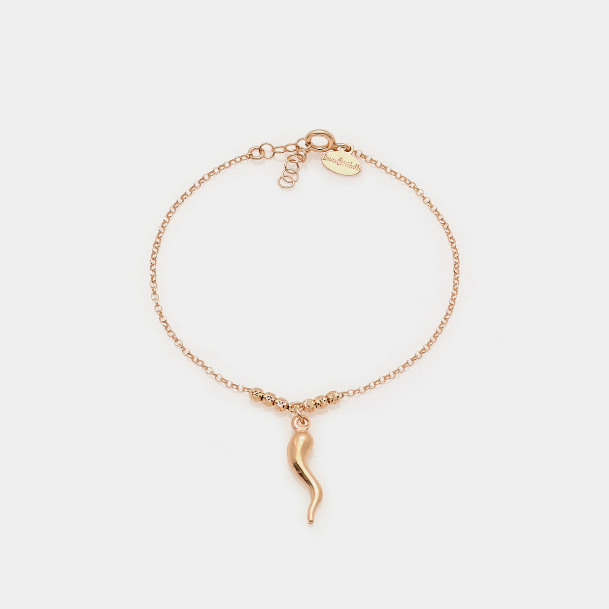 Rose gold plated silver bracelet with faceted spheres and central curved horn pendant