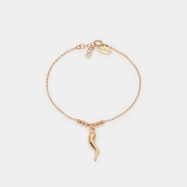 Rose gold plated silver bracelet with faceted spheres and central curved horn pendant