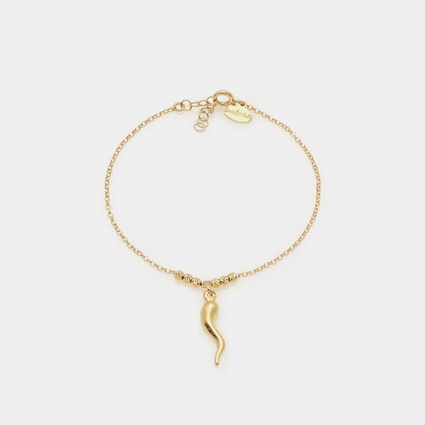 Gold-plated silver bracelet with faceted spheres and central curved horn pendant