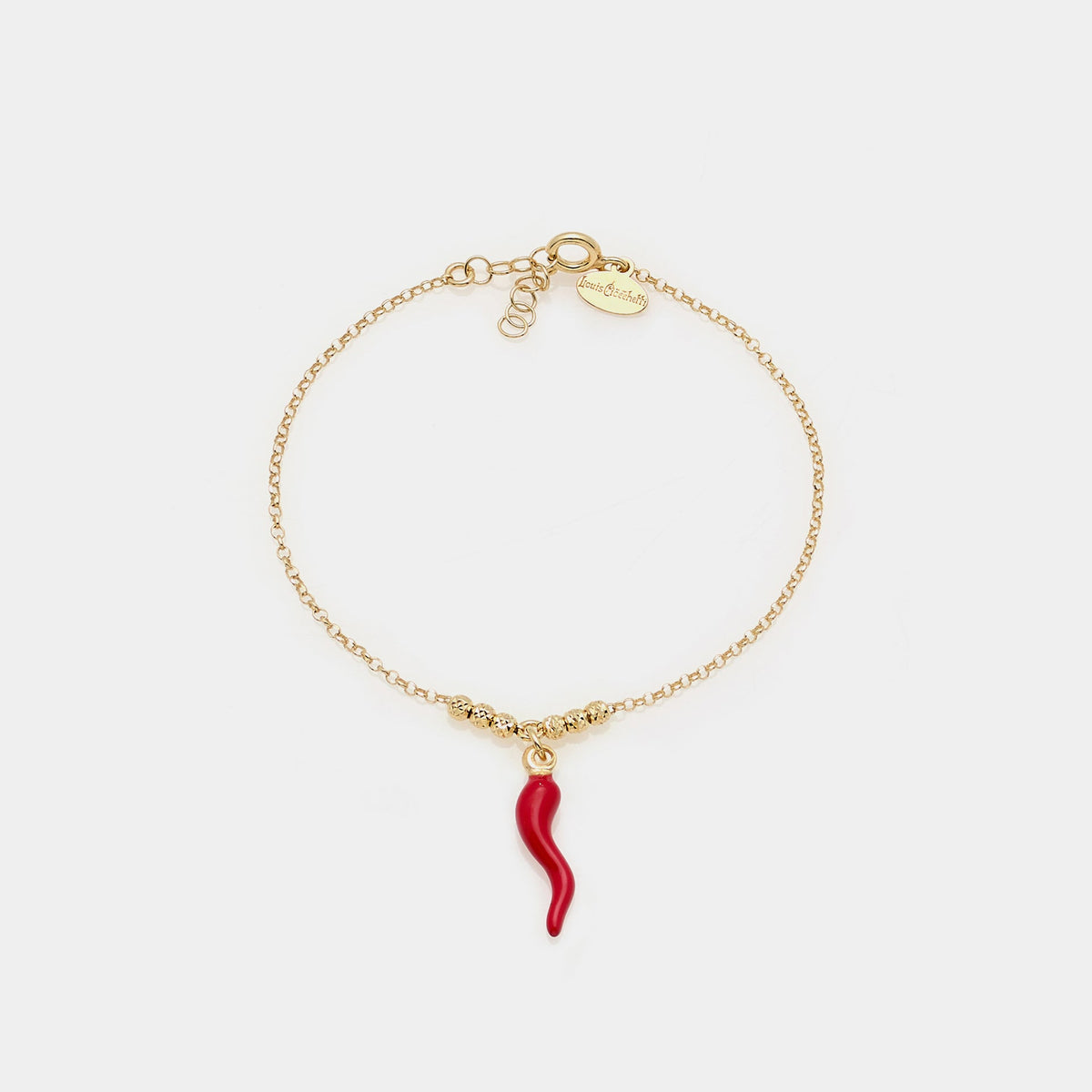 Gold-plated silver bracelet with faceted spheres and central red enameled horn pendant