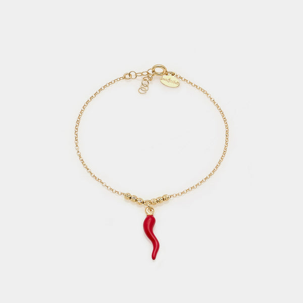 Bracciale argento dorato con sfere sfaccettate e corno smaltato rosso bombato pendente centrale